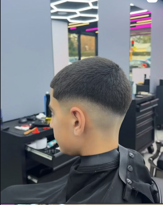 Fresh buzz fade under honeycomb lighting